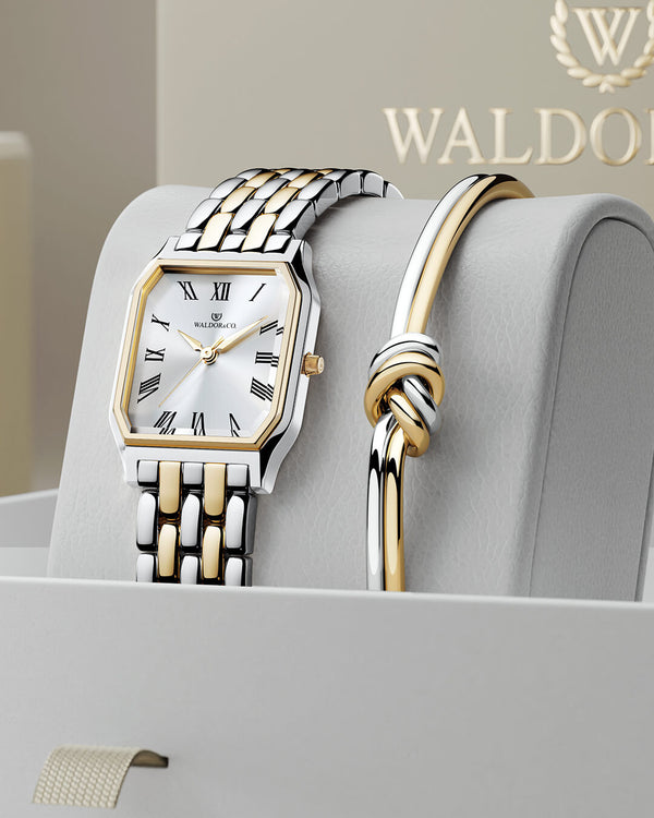 lifestyle_image,A square women’s watch and double knot bracelet in gold and silver from Waldor & co. The model is Eternal 22 Bellagio & Dual Knot Bangle.