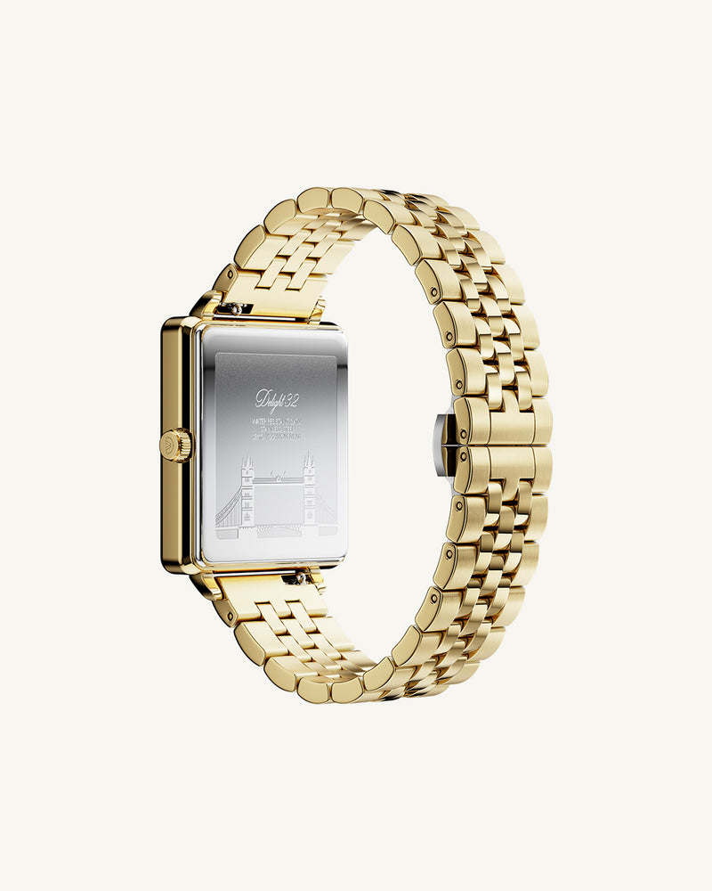 A square womens watch in 14k gold from Waldor & Co. with black sunray dial and a second hand. Seiko movement. The model is Delight 32 Chelsea 28x32mm.