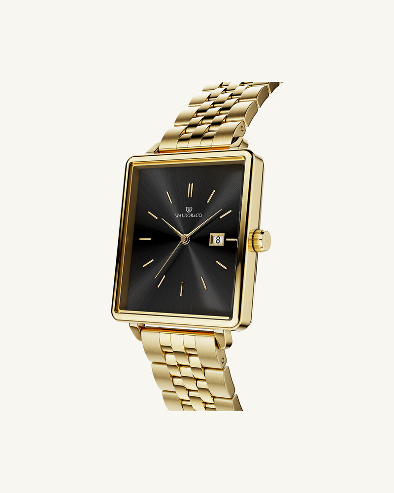 A square womens watch in 14k gold from Waldor & Co. with black sunray dial and a second hand. Seiko movement. The model is Delight 32 Chelsea 28x32mm.