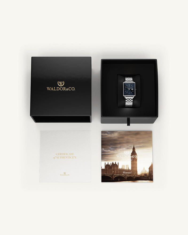 A square womens watch in silver from WALDOR & CO. with blue sunray dial and a second hand. The model is Delight 32 Chelsea 28x32mm.