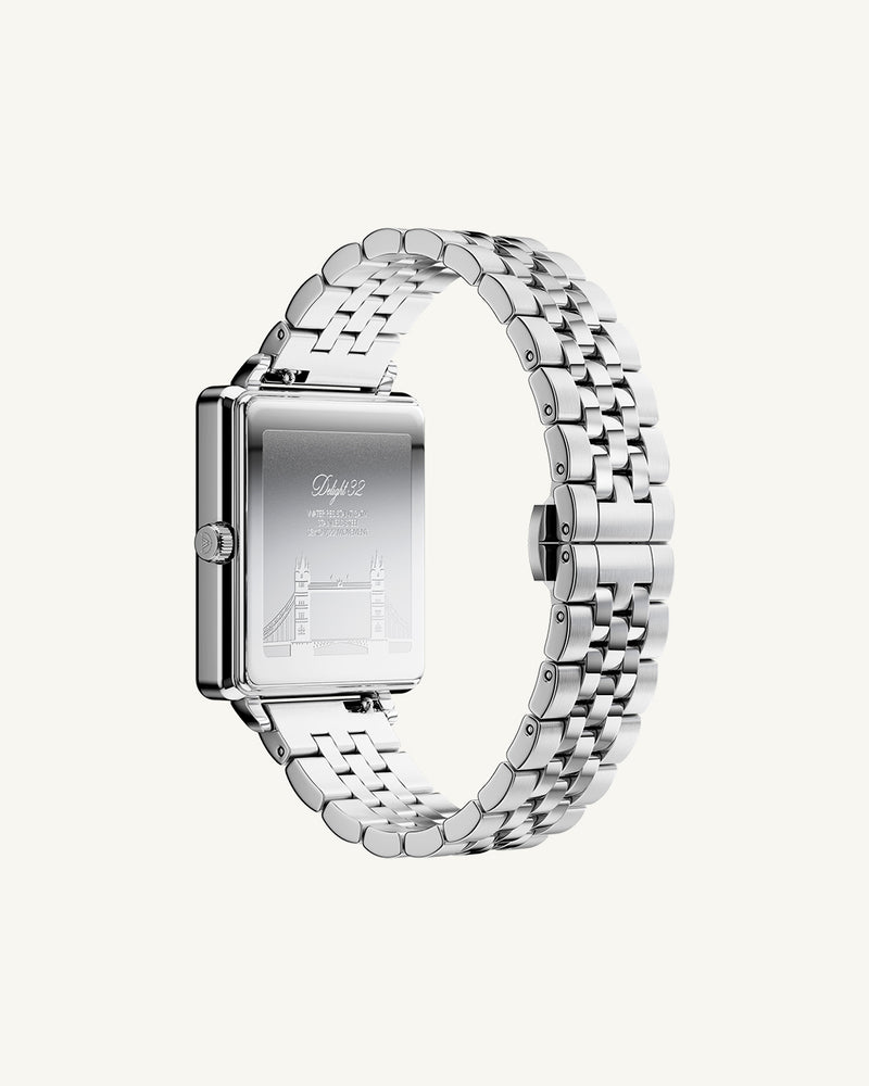 A square womens watch in silver from WALDOR & CO. with blue sunray dial and a second hand. The model is Delight 32 Chelsea 28x32mm.