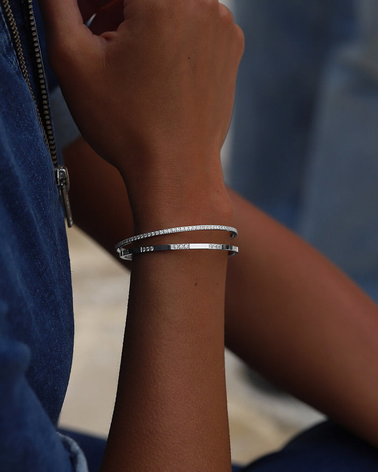 A Bangle in Rhodium-plated 316L stainless steel from Waldor & Co. One size. The model is Dulcet Bangle Polished.