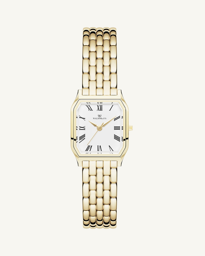 A square womens watch in 22k gold from Waldor & Co. with white Diamond Cut Sapphire Crystal glass dial. Seiko movement. The model is Eternal 22 Bellagio.