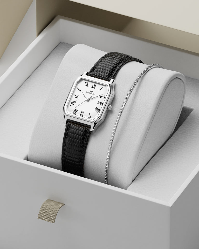 A square womens watch in Rhodium-plated 316L stainless steel with a black genuine leather strap from Waldor & Co. with white Diamond Cut Sapphire Crystal glass dial. Seiko movement. The model is Eternal 22 Varenna.