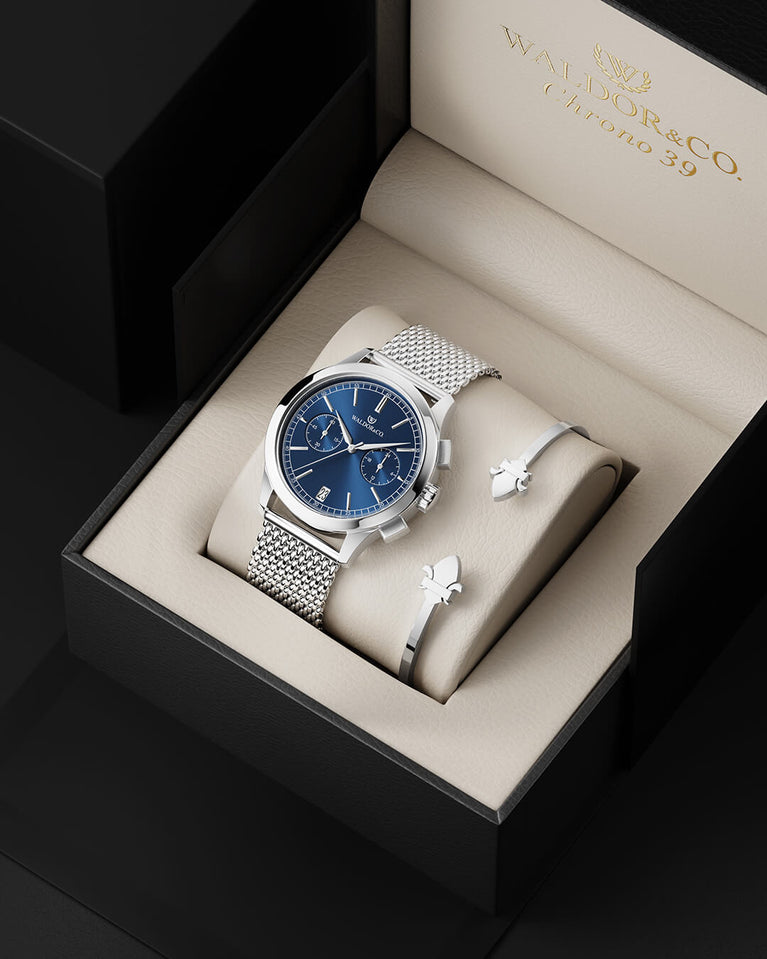 A round mens watch in rhodium-plated silver from Waldor & Co. with blue sunray dial and a second hand. Seiko movement. The model is Chrono 44 Sardinia 44mm.