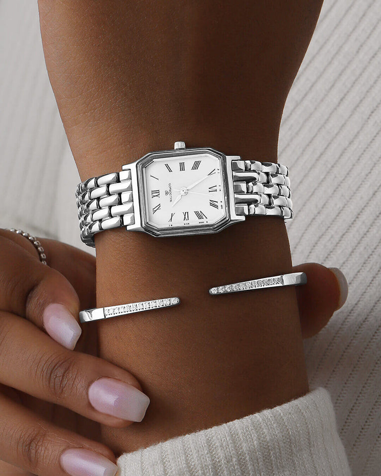 A square womens watch in Rhodium-plated 316L stainless steel from Waldor & Co. with white Diamond Cut Sapphire Crystal glass dial. Seiko movement. The model is Eternal 22 Bellagio.