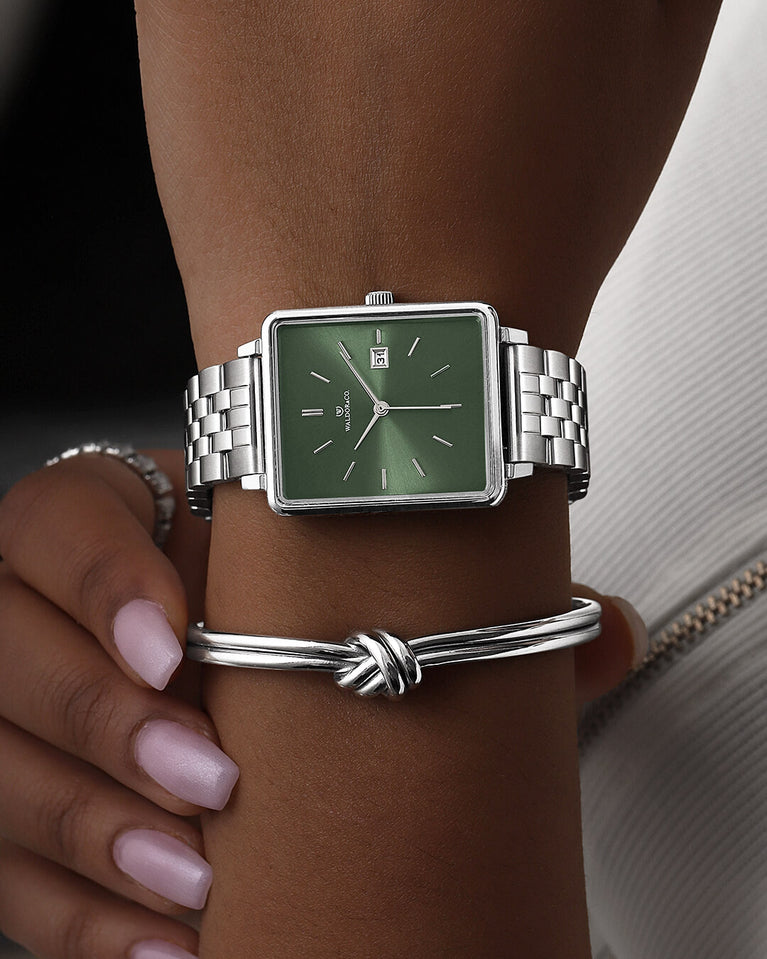 A square womens watch in silver from WALDOR & CO. with green sunray dial and a second hand. The model is Delight 32 Chelsea 28x32mm.
